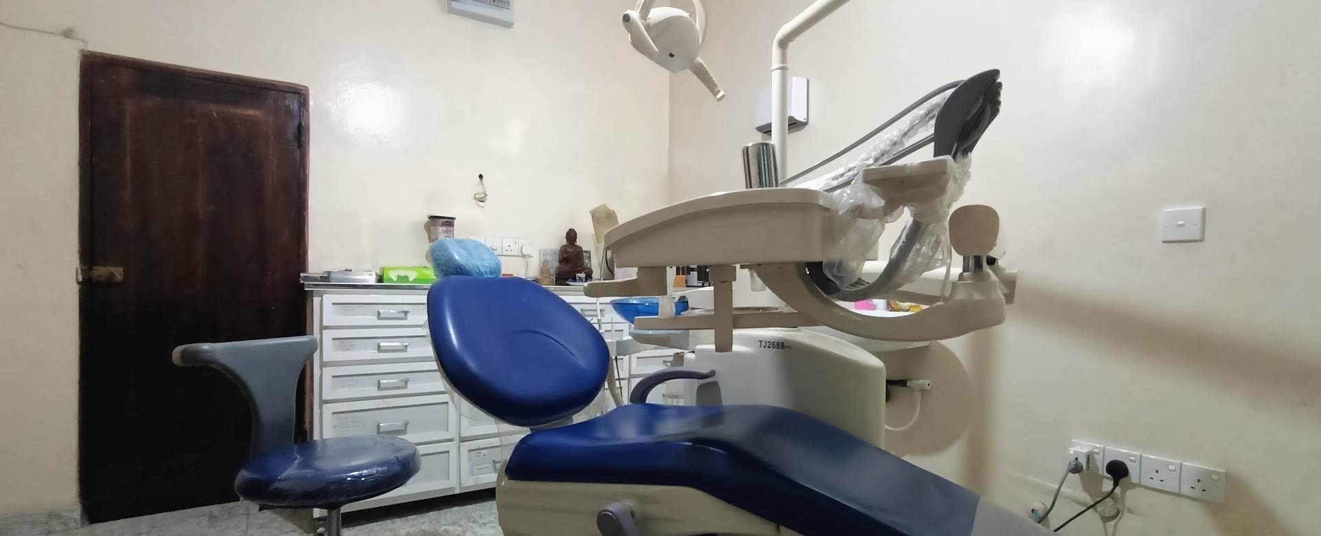 Blue dental chair and treatment equipment inside the clinic